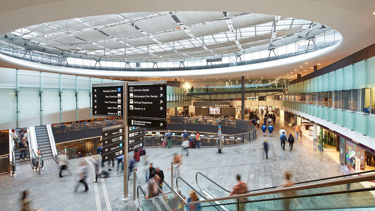 blurred photo of passengers at zurich airport