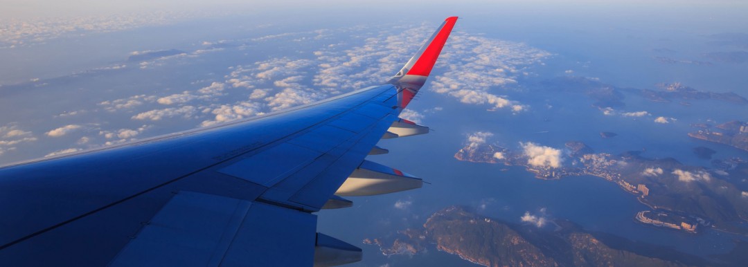 aircraft wing over islands